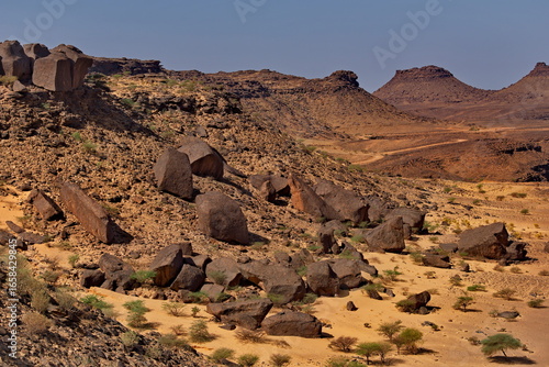 Africa, Mauritania. Giant fragments of rocks of volcanic origin on the rocky plateau of the Agrour Natural Park on the southwestern edge of the Sahara Desert.