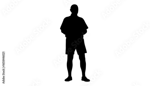 Full shot silhouette of a man in casual clothing, likely shorts and a short-sleeved shirt, standing upright and poised.