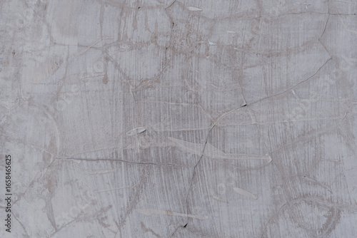 Cracked cement floor texture for background.