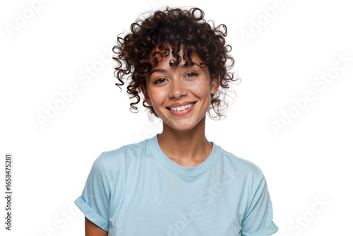 Beautiful smiling woman with curly hair looking directly at the camera, wearing a casual light blue t-shirt, isolated on white background