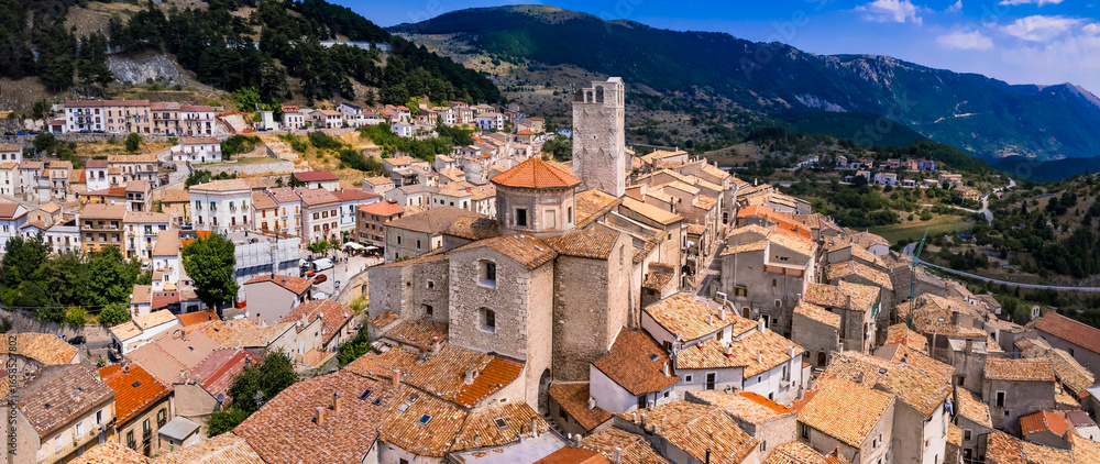 Fototapeta premium Abruzzo tourism, Italy . The most beautiful italian villages (borgo) Castel del Monte - Located in Gran Sasso mountain range. aerial drone panoramic view of picturesque postcard hilltop town