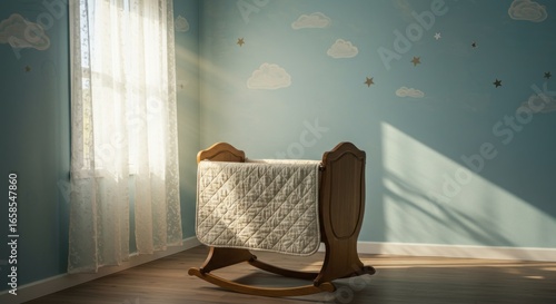 A wooden rocking cradle sits in a room with a skythemed mural