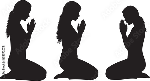 Three women kneeling in prayer silhouette