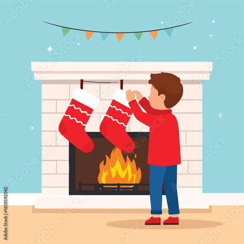 A boy hangs Christmas stockings on a fireplace mantel, ready for the holiday season.