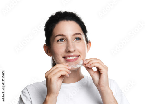 Fototapete Smiling woman wearing dental aligner on white background