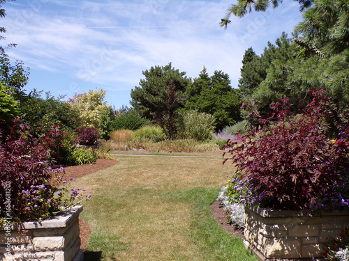 Wallpaper Mural Summer park's landscape with trees and flower beds Torontodigital.ca
