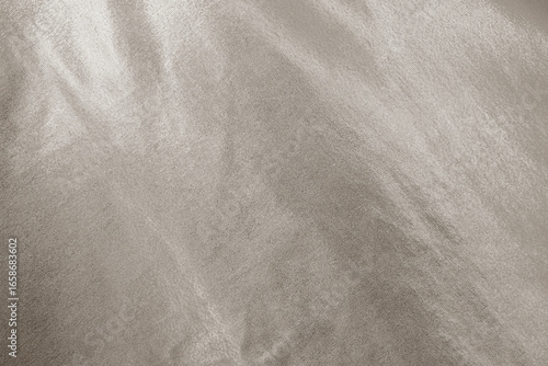 Light soft pale pastel brown gold golden beige nude white abstract background. Shiny silk fabric. Metallic shine. Light reflection. Empty. Blank. Design.