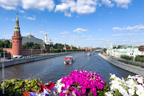 Moscow, Russia - 06.21.2025: Sunny summer view of the Moscow Kremlin, the Kremlin embankment of the Moscow River from a Large stone bridge