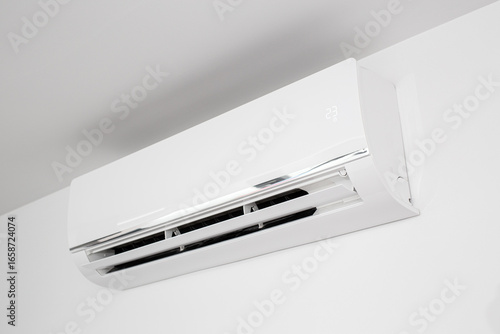 Domestic Indoor Air conditioner unit mounted on wall used for heating or cooling a space