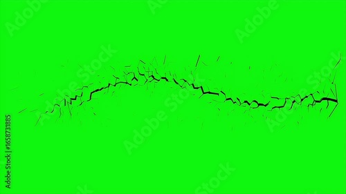 Realistic ground crack spreading on a green screen background for visual effects animation.