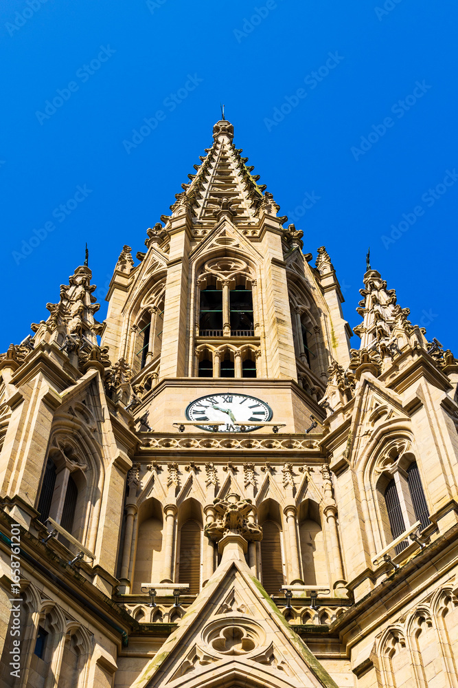 Fototapeta premium Neo-Gothic Bell Tower of the Good Shepherd Cathedral in Donostia-San Sebastián