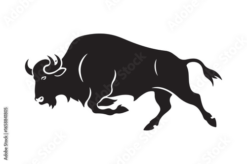 Powerful black silhouette of a charging bison