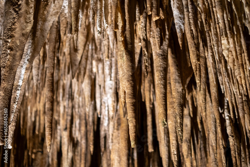 Tablou pe pânză Majestic stalactites in a mysterious cave formation: natural wonders of earth