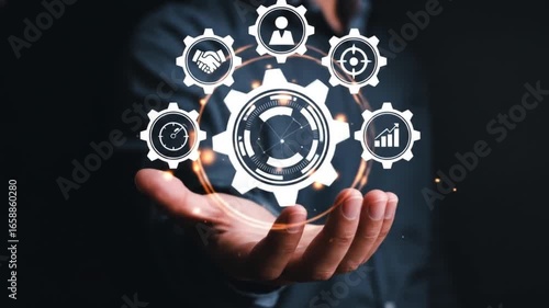 A person's hand holds a glowing digital interface showcasing icons for business process management, workflow automation, and operational efficiency