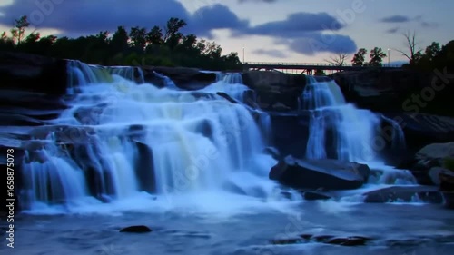 Majestic Waterfall Cascades Through the Verdant Landscape