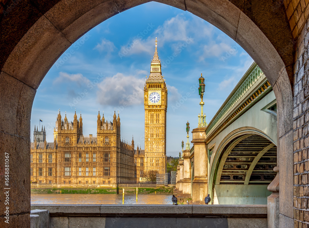 Fototapeta premium Big Ben with Houses of Parliament seen through Westminster bridge arch, London, UK