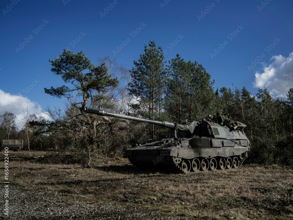 Fototapeta premium PzH 2000NL howitzer positioned in forest environment during tactical exercise