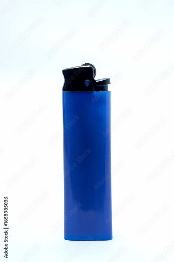 Blue plastic gas lighter standing upright on clean white background, representing everyday tool, simple object, fire source, smoking accessory, ignition device, and modern lifestyle. Blue plastic gas lighter standing upright on clean white background, representing everyday tool, simple object, fire source, smoking accessory, ignition device, and modern lifestyle.