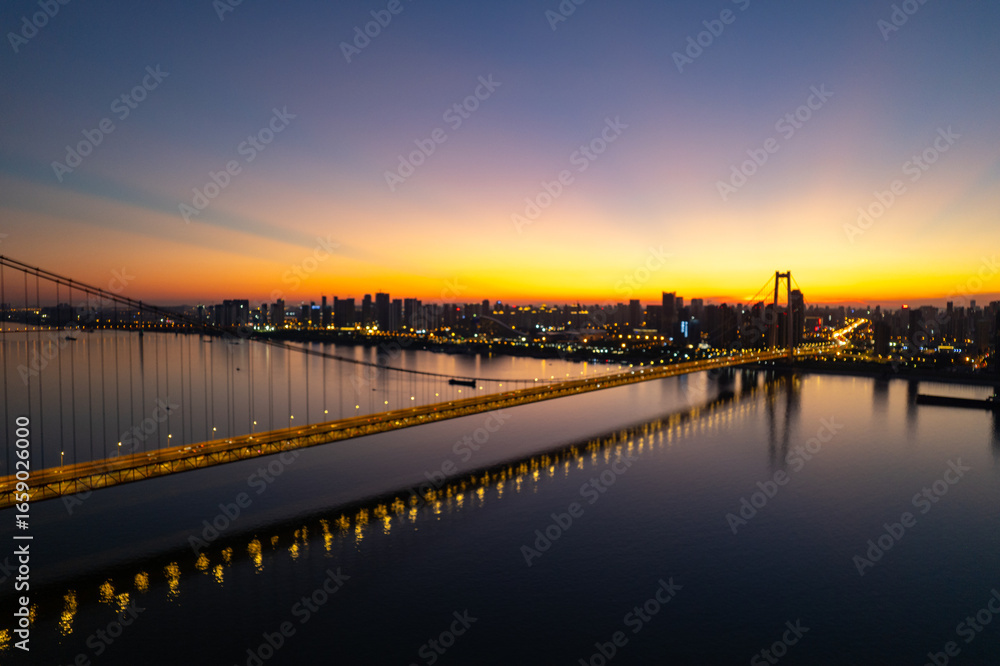 Wuhan china bridge city skyline at sunset reflection Wuhan china bridge city skyline at sunset reflection