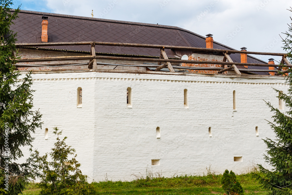 Fototapeta premium Restoration and repair of the outer wall of the Orthodox Borovsko-Pafnutiev Monastery in August 2024, Borovsk, Russia