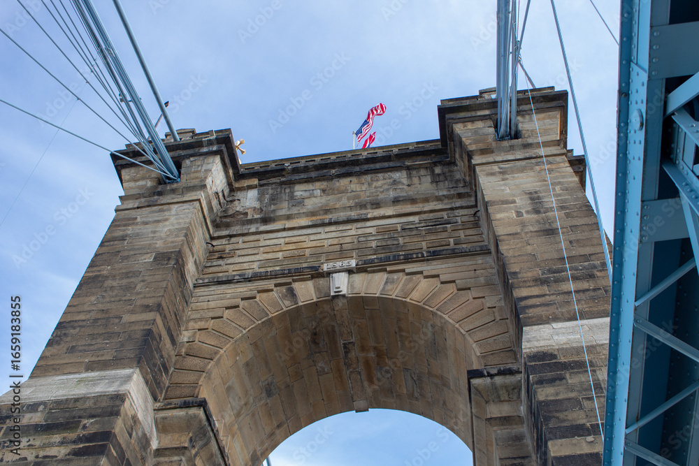 Fototapeta premium View of one of the towers of the Roebling Suspension Bridge while closed for repairs in April 2019 due to sandstone particles falling from one of the towers.