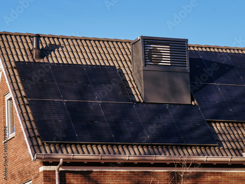 Modern house with integrated heat pump and solar panels on the roof in Assen, Netherlands