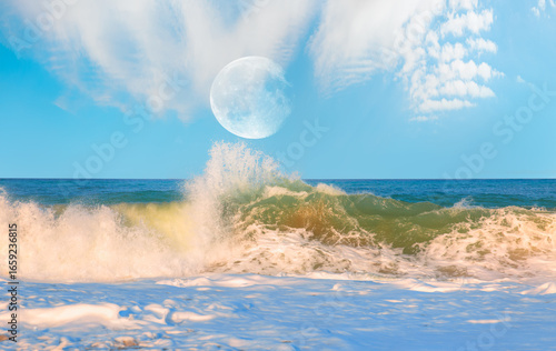 Fototapeta Naklejka Na Ścianę i Meble -  Power sea wave breaking on the shore, full moon in the  background  