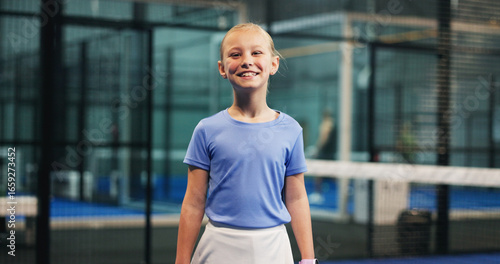 Fotografía Tennis portrait, child and happy on court for match practice, game exercise and tournament workout