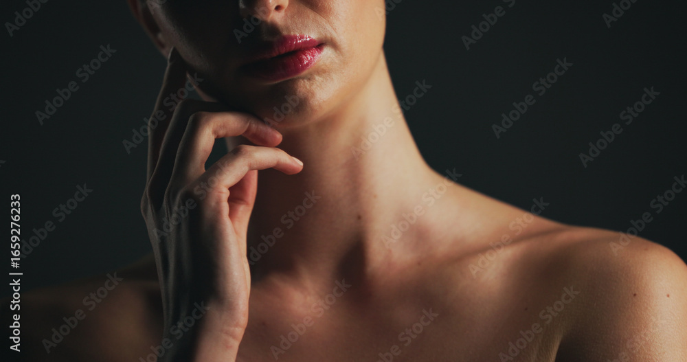Obraz premium Shoulder, glow and hand of woman in studio for dermatology, body care and hygiene. Collagen benefits, aesthetic and shine with closeup of person on black background for space, grooming and touch