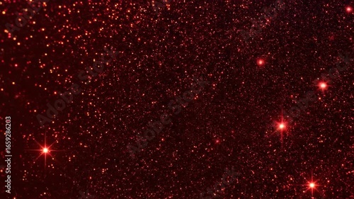 A dense field of tiny red glitter sparkles against a dark background, some with bright points