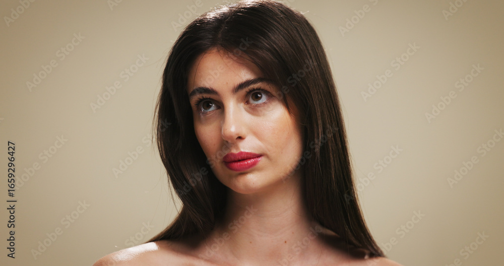 Naklejka premium Makeup, skincare and thinking with woman on studio background for cosmetic ideas or vision. Beauty, foundation and glow with female model on space for facial results, lipstick color or wellness