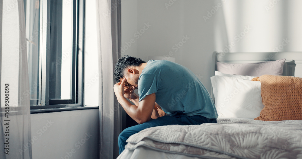Obraz premium Frustrated, man and stress on bed at house with insomnia, sleeping disorder and depression. Tired, male person and mourning loss with mental health crisis, loneliness and emotional burnout in bedroom