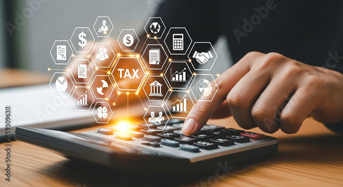 Person calculating taxes on a calculator with digital tax icons overlaying the calculator keys