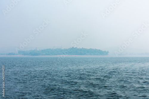 Serene Island Landscape with Calm Waters and Misty Atmosphere