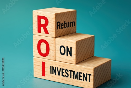Stacked wooden blocks spell out Return On Investment, symbolizing financial growth and illustrating potential gains with tangible, positive economic forecast.