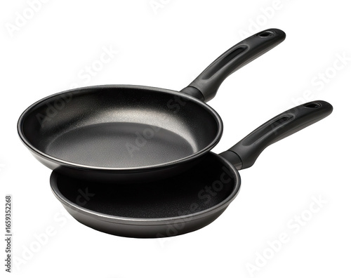 Two dark, stacked frying pans with handles
