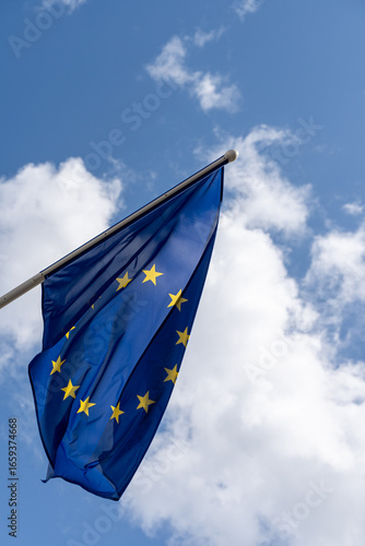August 6, 2025, Tallinn, Estonia: European Union flag waving in the wind with clouds in the background.