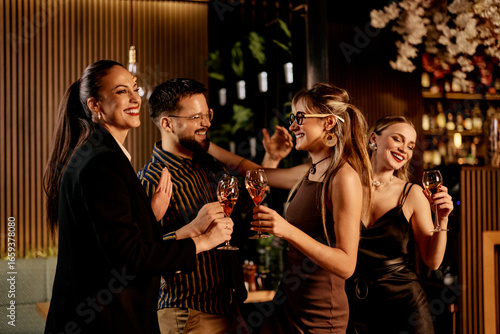 Photography Group of Friends Enjoying Drinks and Conversation at a Stylish Indoor Gathering