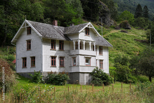 Old wooden white house on the hillside in Flam, Sognefjord, Norway, Scandinavia.