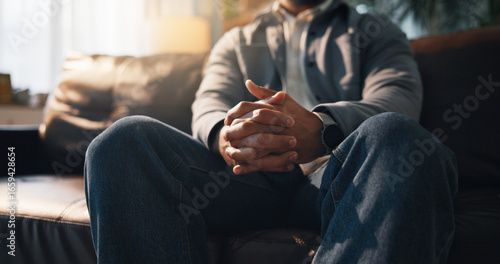 фотографія Anxiety, hands and therapy with person on sofa in office for consulting or counseling appointment