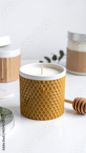 Scented candle in honey-comb patterned container