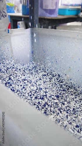 HDPE plastic recycling process for sustainable industry. Used plastic bottles turned into clean recycled pellets for eco-friendly manufacturing and green business solutions.