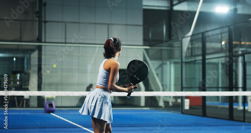 Photos Padel tennis, athlete and woman with racket, court or practice for tournament, wellness or training