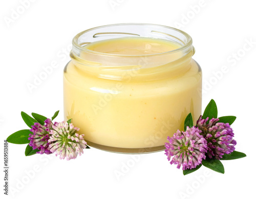 Jar of golden royal jelly with vibrant clover blossoms, perfect for health and wellness products