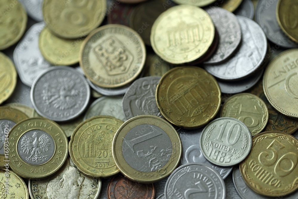 Big pile of different coins from various currencies and different countries around the world. Currency exchange Big pile of different coins from various currencies and different countries around the world. Currency exchange