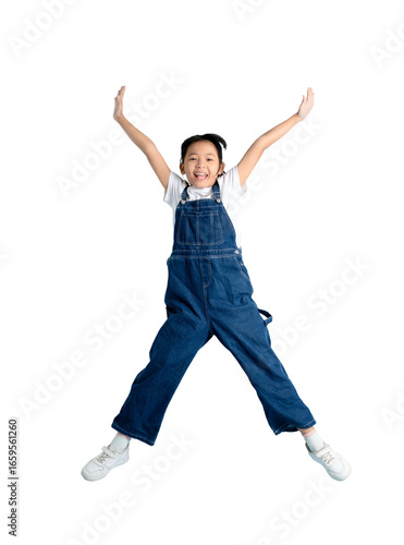 Canvastavla A young girl happily jumps in the air, arms outstretched on PNG