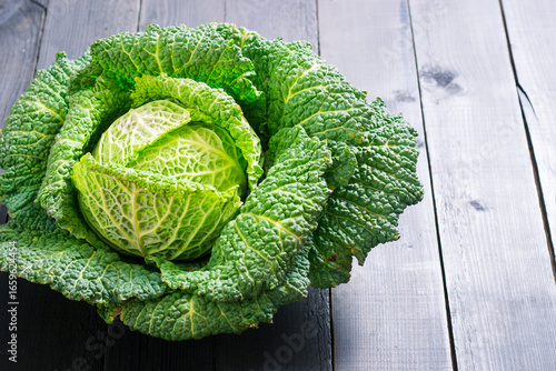 savoy cabbage from organic grower farm, on black wooden table