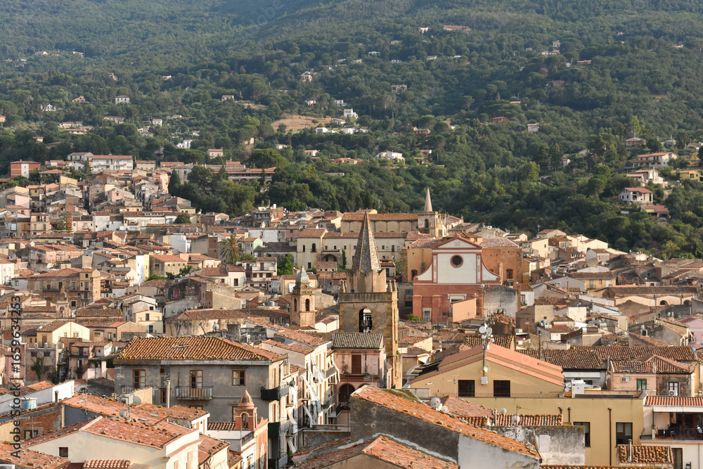 Obraz premium Panoramic view of Castelbuono from the Ventimiglia Castle, Castelbuono, Island of Sicily, Italy. Cityscape view of ancient village. Palermo Province, Madonie mountains on background. 