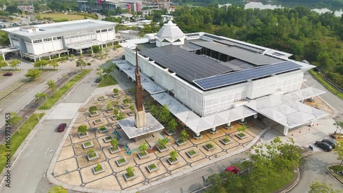 Aerial: Raja Haji Fisabilillah Mosque (Cyberjaya Mosque) with solar panels during the day in Cyberjaya, Sepang, Selangor, Malaysia, orbit drone shot