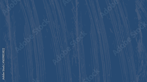 A close up shot of a dark blue surface with subtle vertical lines and textured appearance throughout image